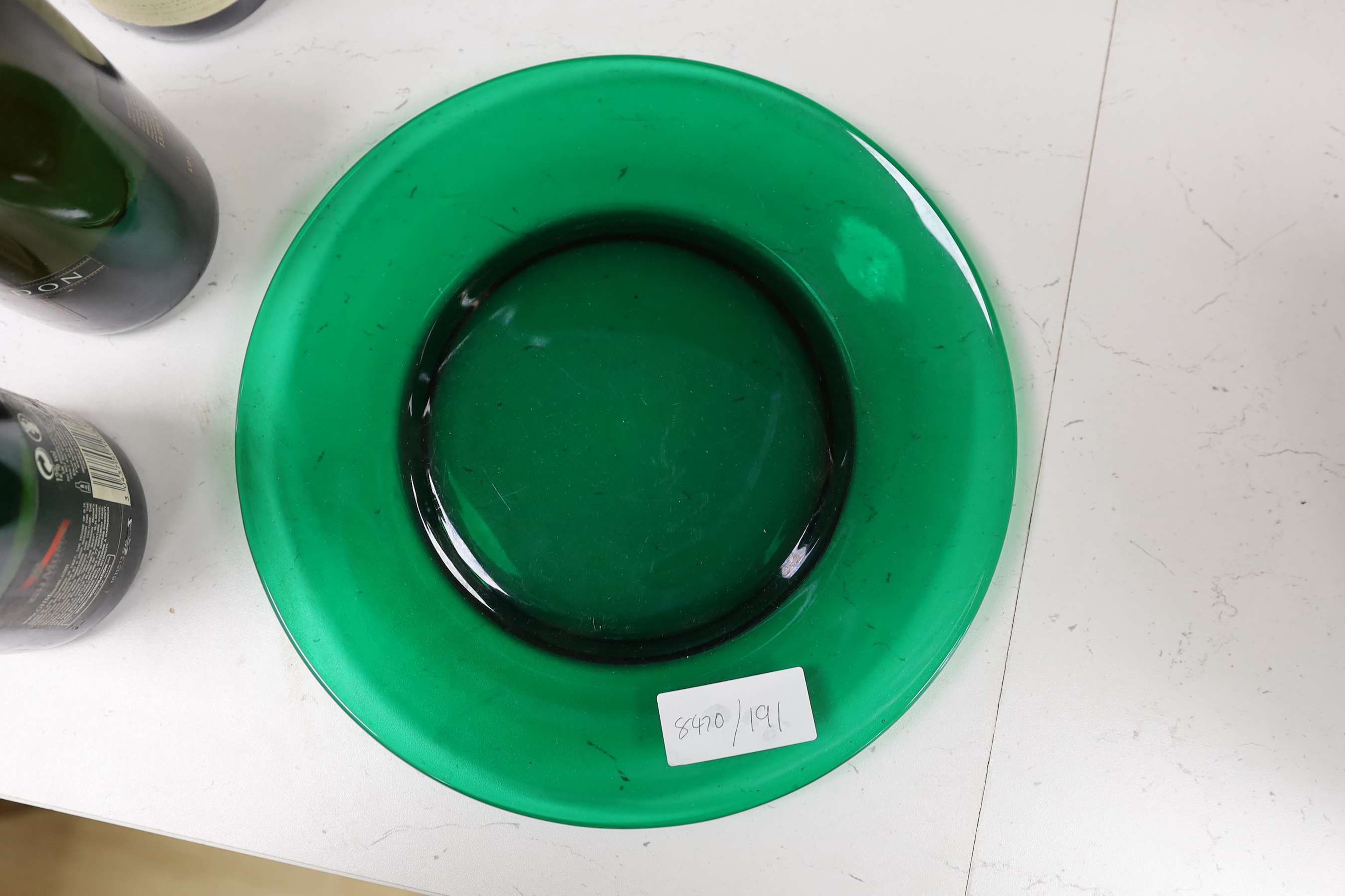 Fifteen Roland James of San Francisco green glass plates and one large serving plate